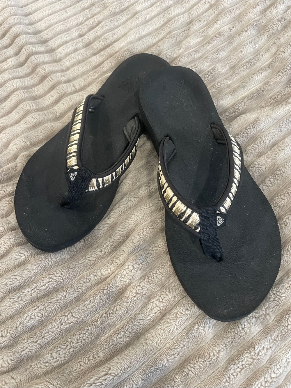 Roxy Black Flip Flops with Zebra-Patterned Straps
